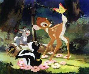 Bambi and his friends Flower and Thumper in the woods playing with a butterfly puzzle