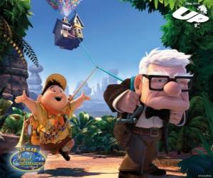 Carl and Russell loading by foot with the flying house in their trip towards the wild territories puzzle