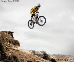 Cyclist of mountain bike or MTB jumping puzzle