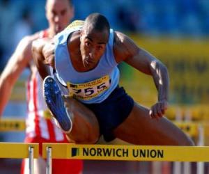 Hurdling, athlet crossing over the hurdle barrier puzzle