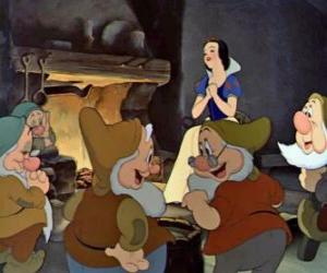 Snow White and the dwarfs talking in the dining room of their house puzzle
