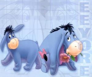 The ass Eeyore in two images with a ribbon on the tail and the other with a flower in her mouth puzzle