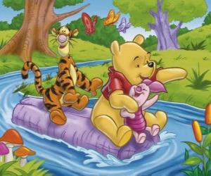 Winnie The Pooh and his friends Tigger and Piglet sat on a log down the river puzzle