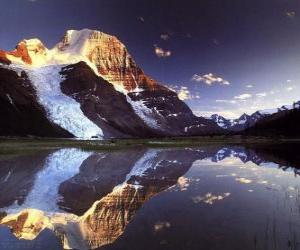 A lake reflects the mountain office in its waters puzzle