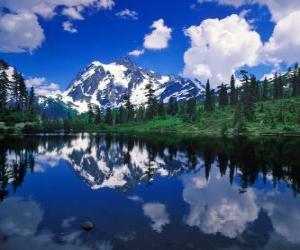 A lake reflects the mountain office in its waters puzzle