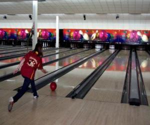 Bowling - Player throwing the ball toward the pins puzzle