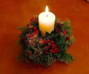Candle ignited as a centerpiece adorned with sprigs of holly and fir puzzle