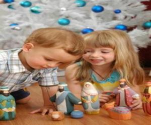 Children playing with the manger puzzle