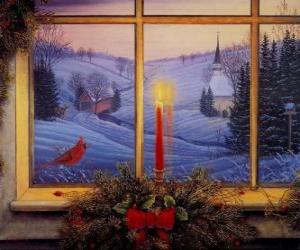 Christmas candel lit in front of a window puzzle