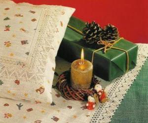 Christmas candle burning along with other Christmas decorations puzzle