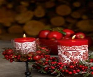 Christmas Candles lit and decorated with red berries puzzle