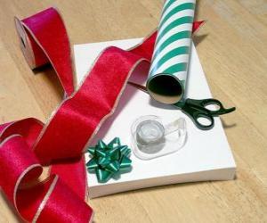 Christmas gifts with decorative ribbon and scissors puzzle