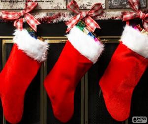 Christmas socks with decoration and hanging on the wall of the chimney puzzle