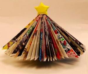 Christmas tree made from leaves of magazines and a yellow star at the tip puzzle