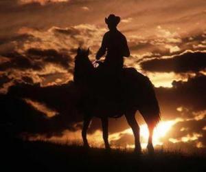 Cowboy riding at dusk puzzle