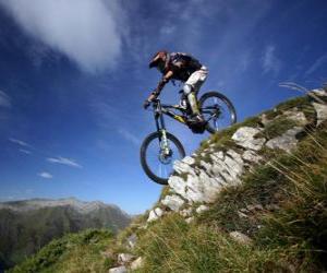 Cyclist ready for a downhill racing on his bike puzzle