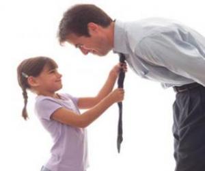 Dad watching his daughter as he knotted tie puzzle