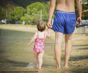 Father and daughter on the beach puzzle