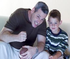 Fathers and son enjoying a match puzzle