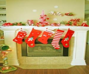 Fireplace in Christmas with the hung socks and with Christmas decorations puzzle