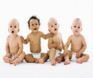 Four babies sitting on the floor puzzle