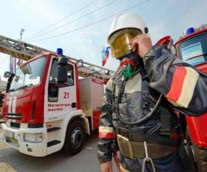 Fully equipped firefighter next to the truck puzzle