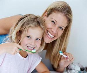 Girl brushing her teeth, an essential practice to dental health puzzle