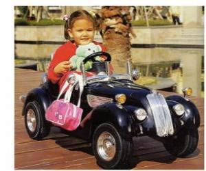Girl on a classic toy car puzzle