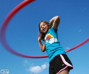 Girl playing with hula hoop, hula hoop spinning at the waist puzzle