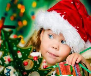 Girl preparing the Christmas holidays puzzle