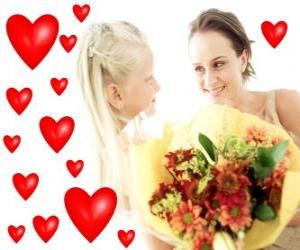 Girl with a bouquet of flowers for his mother and red hearts puzzle