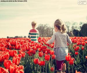 Girls between tulips puzzle