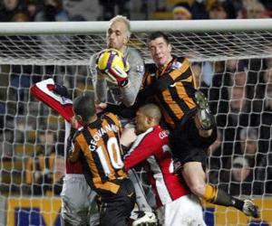 Goalkeeper jumping and catching the ball puzzle