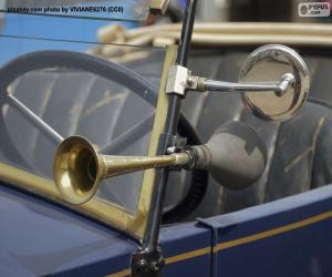 Horn and rear-view mirror of an old car puzzle