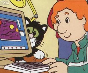 Julian Clifton playing on the computer. Julian is the son of Postman Pat puzzle