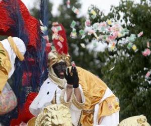 King Balthasar in the parade throwing candy puzzle