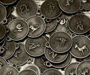 Medals with the signs of the Chinese zodiac puzzle