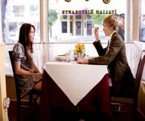 Miley Stewart (Miley Cyrus) in a restaurant with his friend Travis Brody (Lucas Till) puzzle