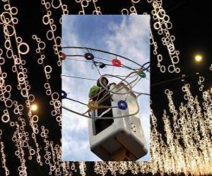 operator placing ornamental Christmas lights puzzle