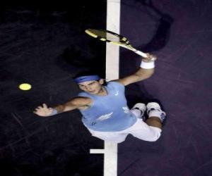 Rafa Nadal preparing to hit a serve puzzle