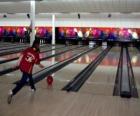 Bowling - Player throwing the ball toward the pins