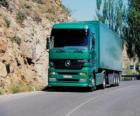 Truck trailer green circulating on a two-way road