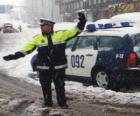 Policeman or police officer stopping traffic