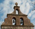 Bell Tower of a church with two bells and a cross on the top