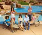 Chad (Corbin Bleu), Taylor (Monique Coleman), Gabriella Montez (Vanessa Hudgens), Troy Bolton (Zac Efron), Ryan Evans (Lucas Grabeel), Sharpay Evans (Ashley Tisdale) beside the pool