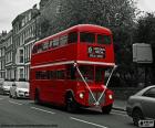 London bus going through one of its streets