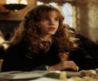 Hermione Granger, friend of Harry, reading a book at school
