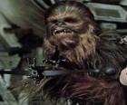 Chewbacca, the huge and hairy wookiee, pointing with his gun