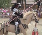 Knight in armor and with his spear ready mounted on his horse also protected with armor