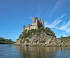 Towers with battlements or merlons of a castle that rests on the rocks